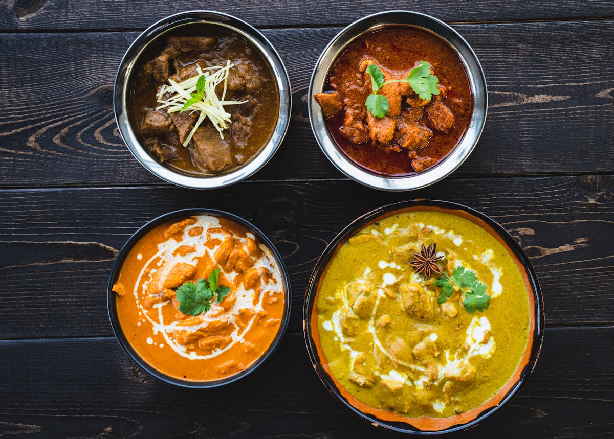 Vibrant Sri Lankan curries in bowls, showcasing the rich flavors of local cuisine