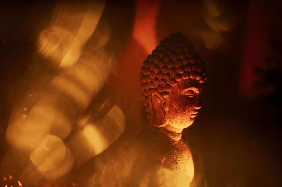 Peaceful Buddha statue illuminated by warm golden light - meditation retreat