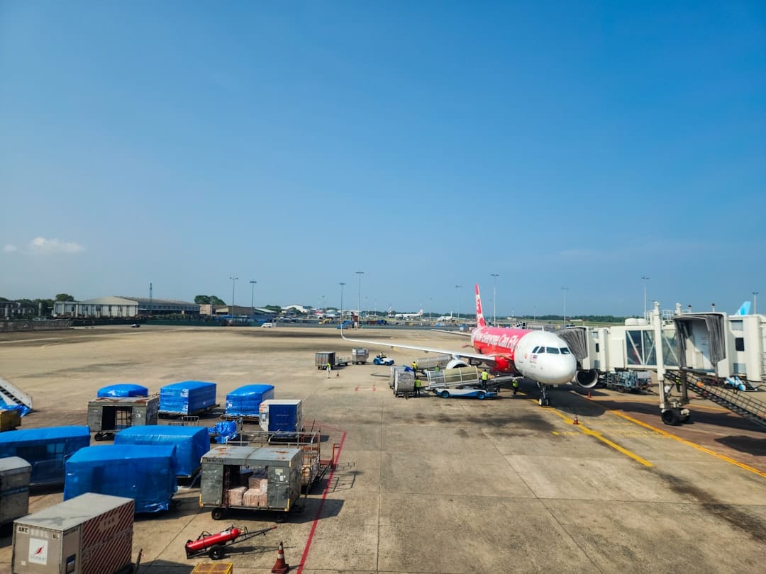 An airplane is at the airport, ready to go.